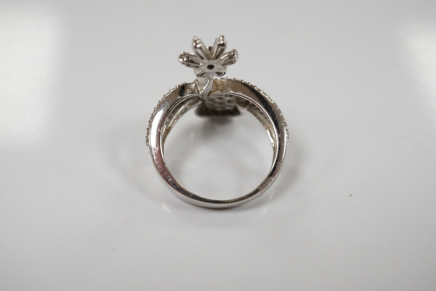 A modern 18ct white gold and diamond cluster set split shank double flower head ring, size K, gross weight 4.5 grams. Condition - good